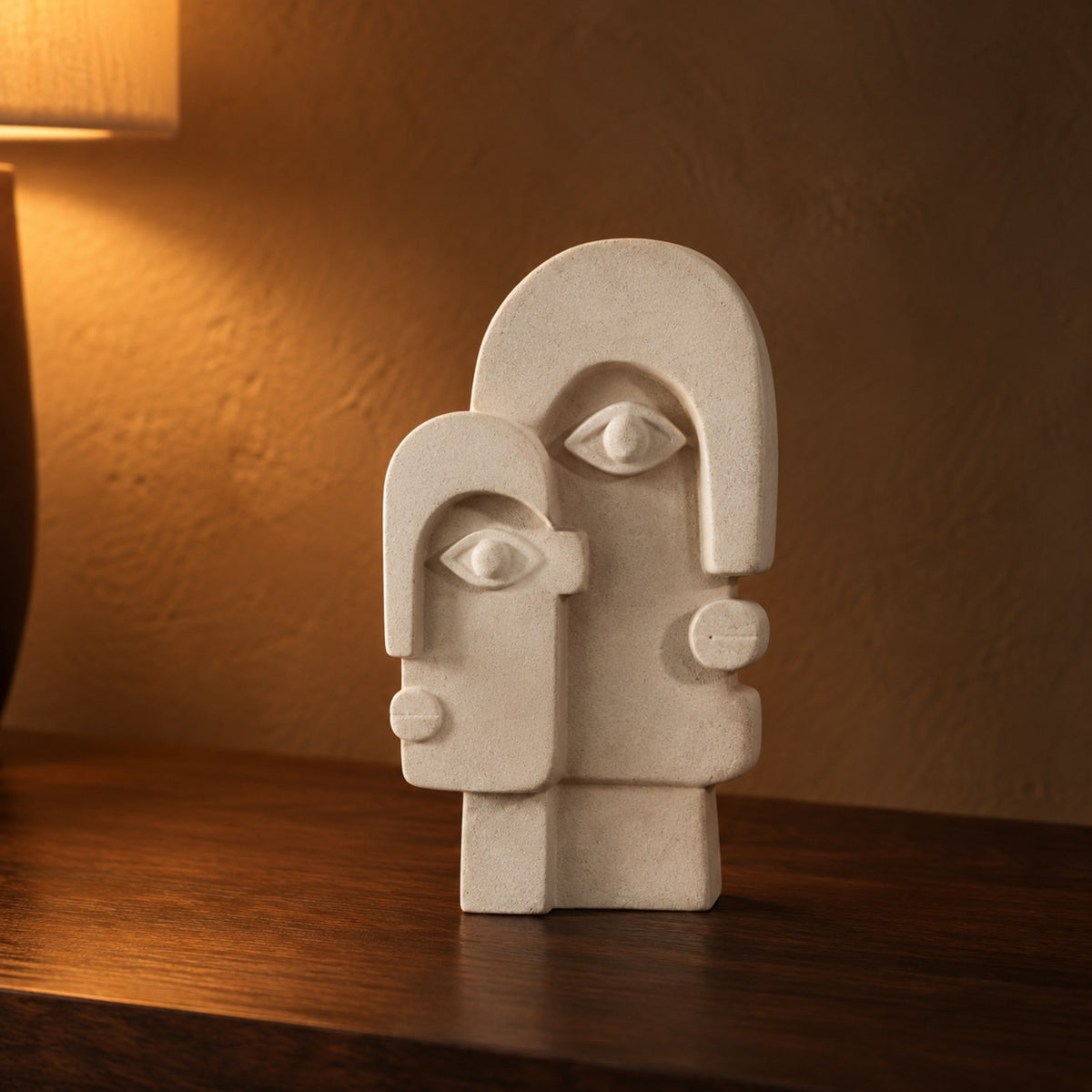 Duo Face Ceramic Sculpture close up on a walnut console
