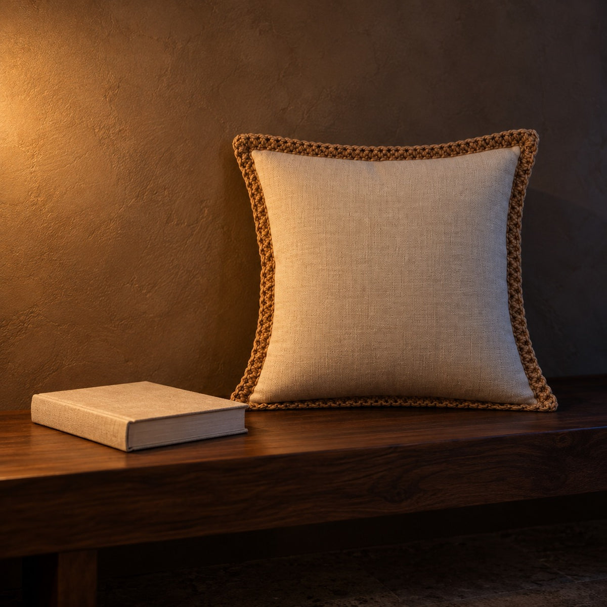 Linen cushion next to a hardcover book for size