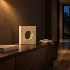Travertine Moon Window Sculpture lifestyle, on a walnut console at night
