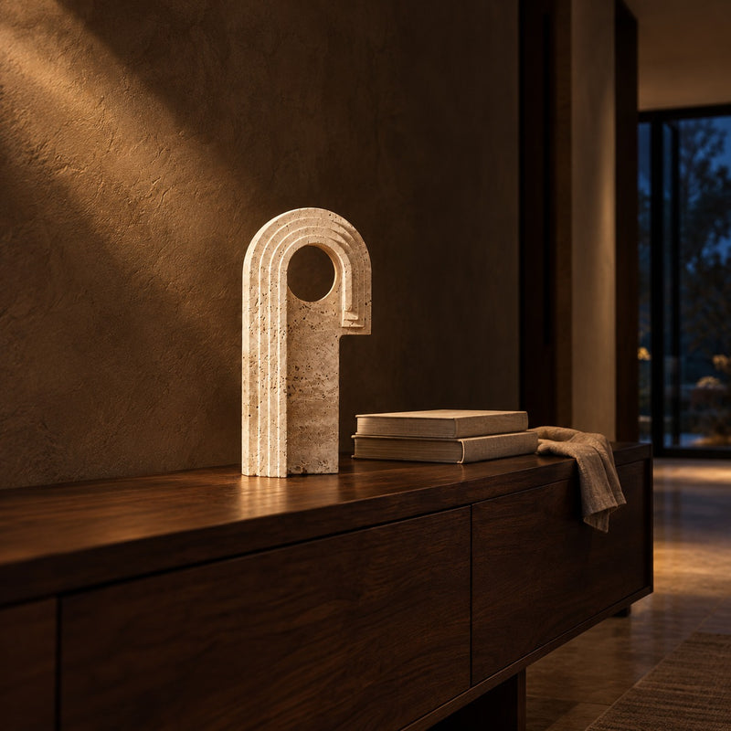 Travertine Arch Sculpture with Round Window lifestyle, in a living room at night