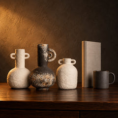 Wabi Sabi Ceramic Vase Trio beside a coffee mug and a hardcover book, showing heights of 16 to 22 cm
