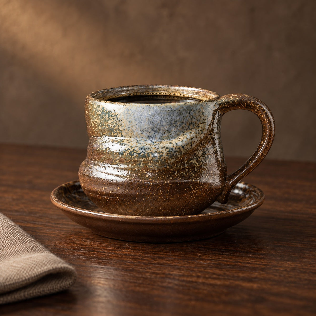 Kiln Pinch cup and saucer in Bronze