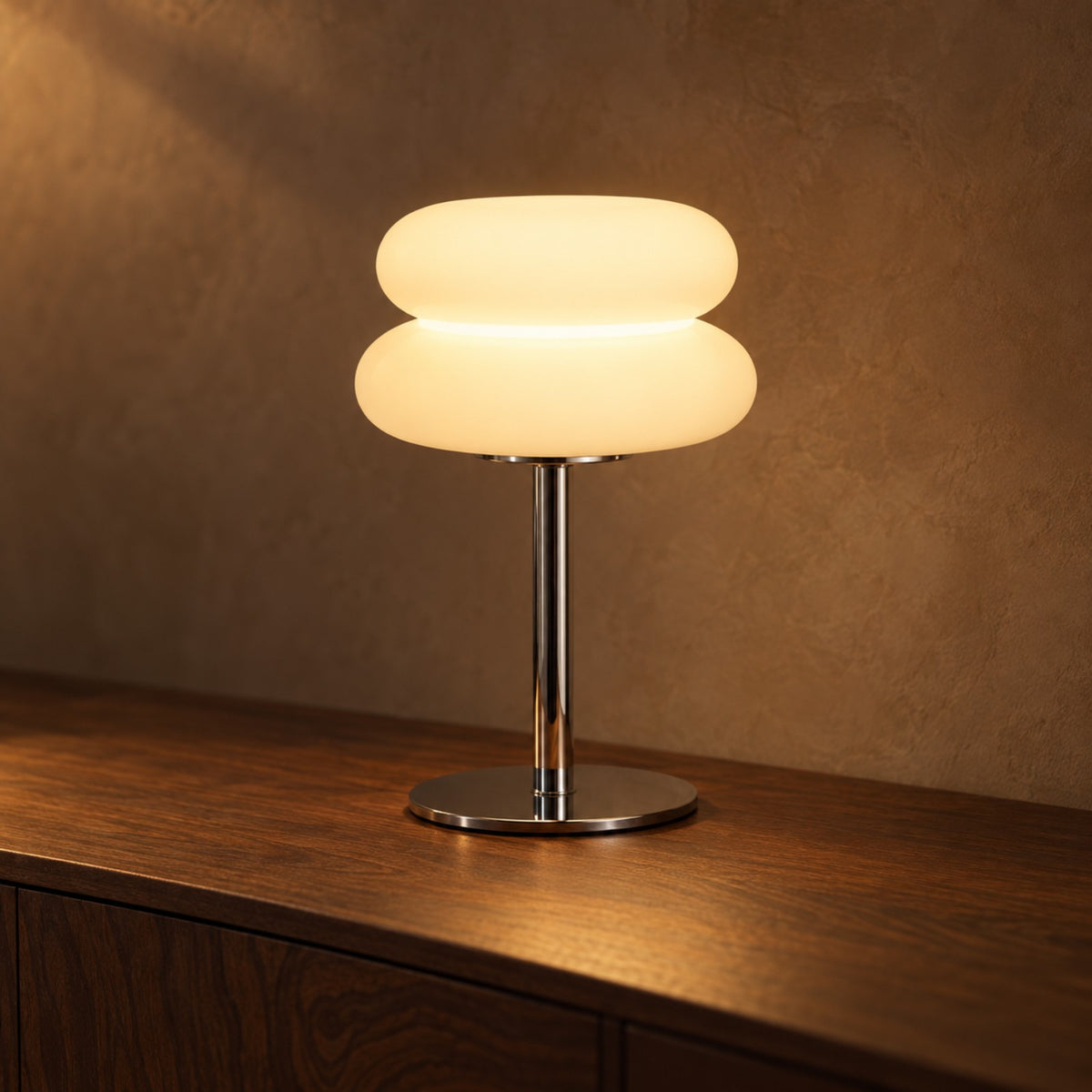 White stacked opal table lamp on a dark walnut sideboard