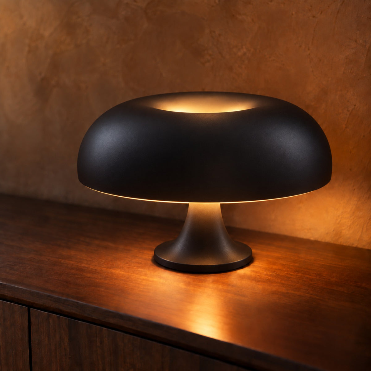 Black mushroom table lamp on a dark walnut sideboard