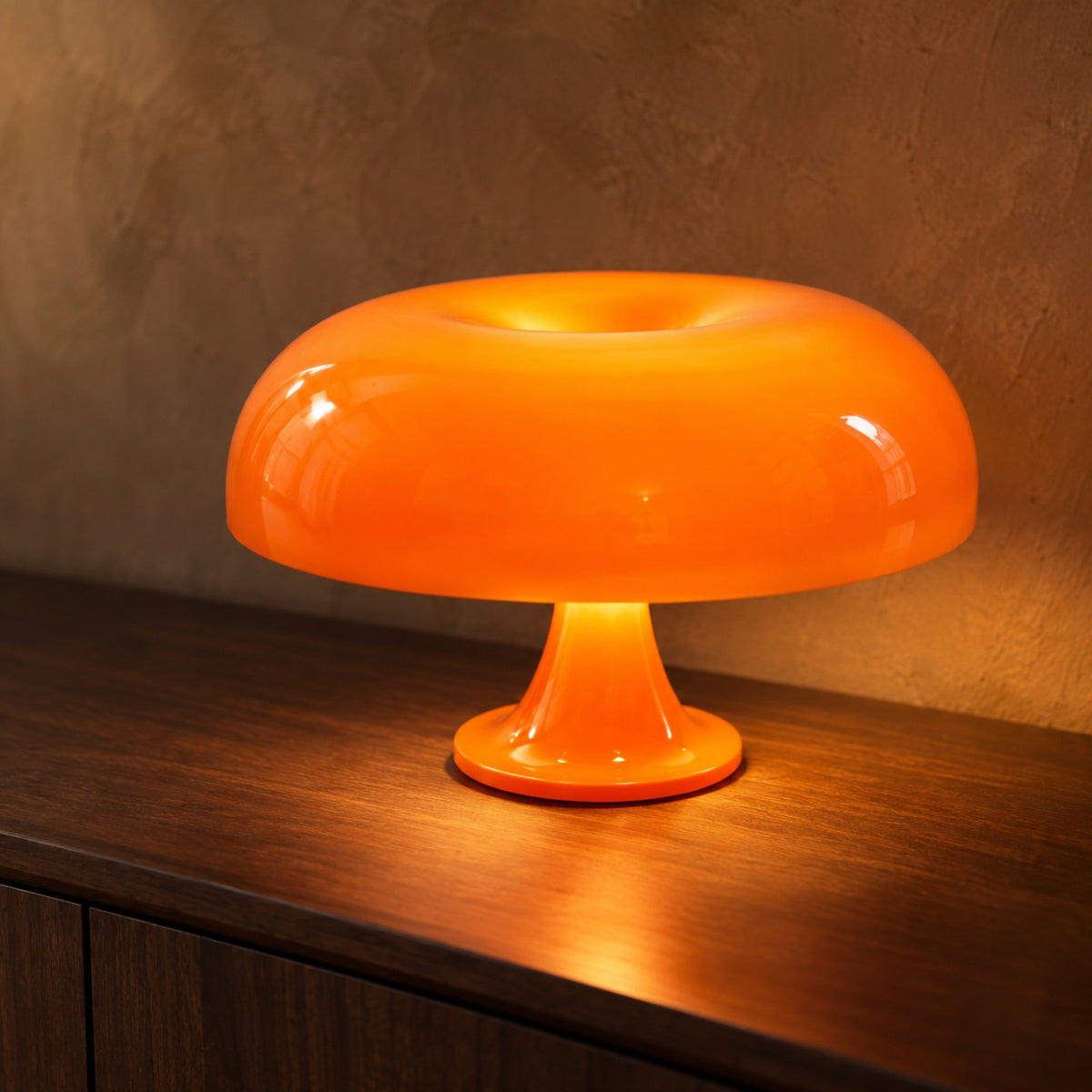 Orange mushroom table lamp on a dark walnut sideboard