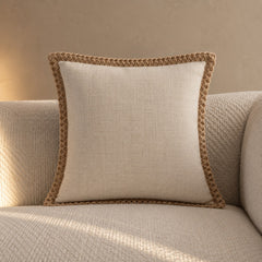 Natural linen cushion with braided edge