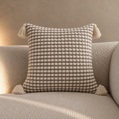 Stone tassel cushion, chunky woven with corner tassels
