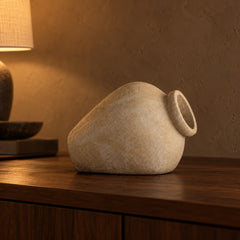 Tilt Sandstone Ceramic Vessel close up on a walnut console