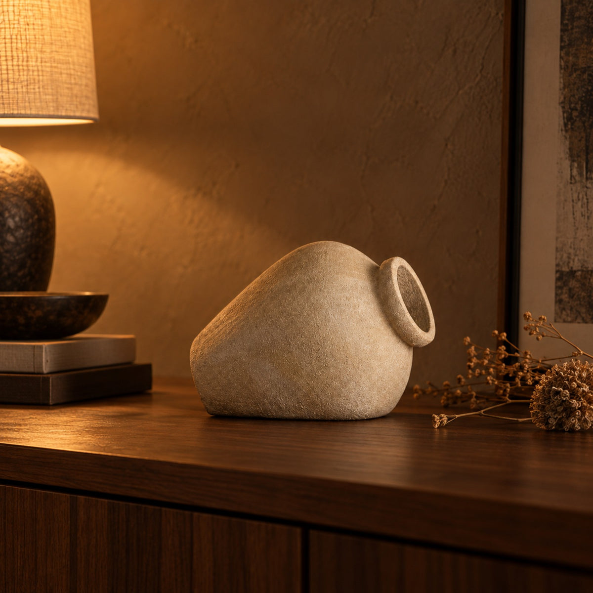 Tilt Sandstone Ceramic Vessel styled beside a lamp